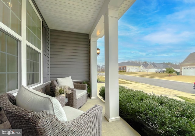 balcony with a residential view and covered porch