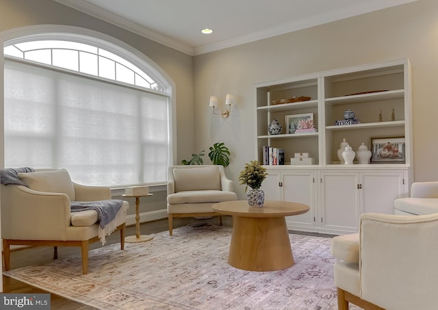 sitting room featuring light wood-style flooring, recessed lighting, and ornamental molding