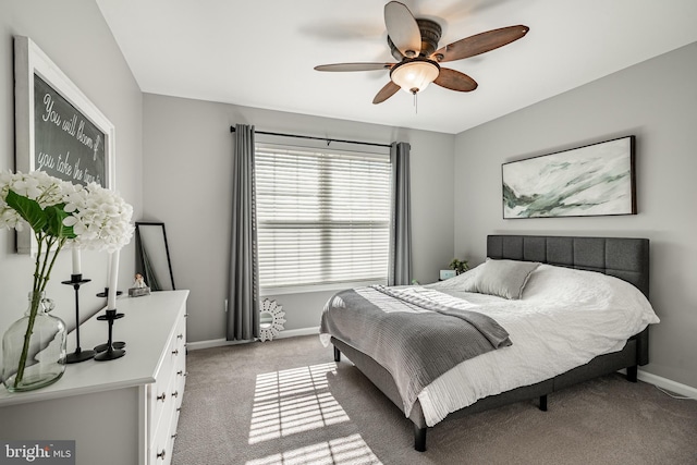 bedroom with baseboards, light carpet, and a ceiling fan