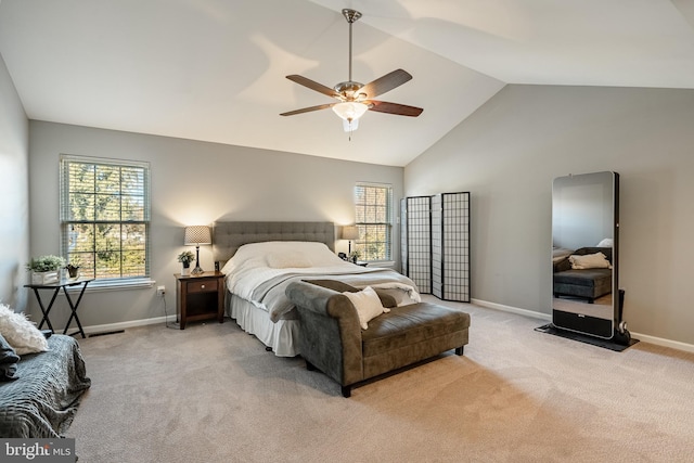 bedroom with light carpet, a ceiling fan, baseboards, and vaulted ceiling