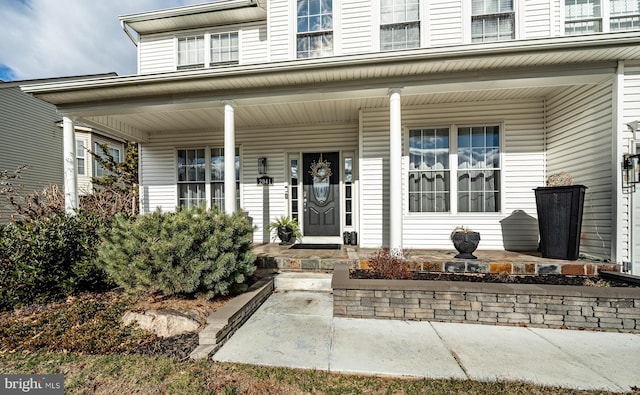 doorway to property with covered porch