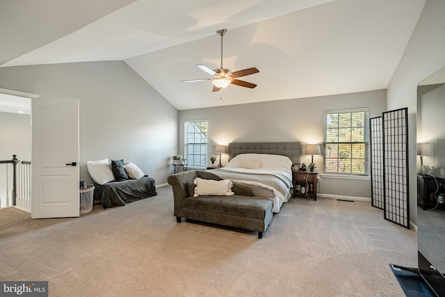 carpeted bedroom with a ceiling fan, multiple windows, baseboards, and visible vents