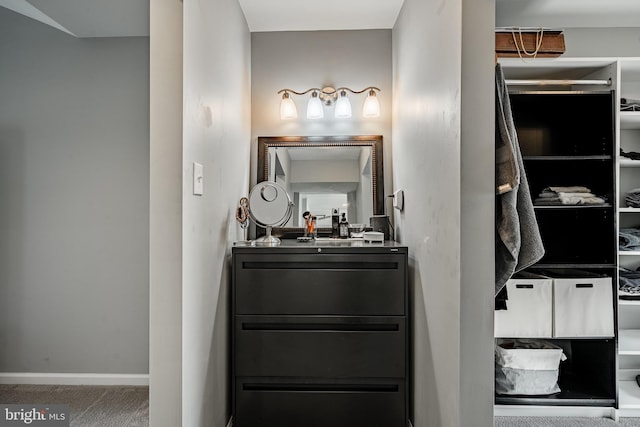 bathroom featuring baseboards and vanity