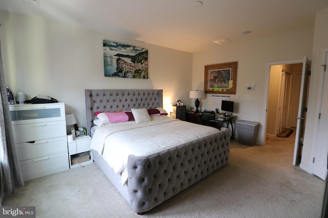 bedroom featuring light carpet