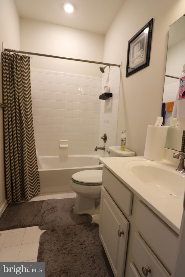 full bathroom featuring tile patterned floors, toilet, vanity, and shower / bath combo