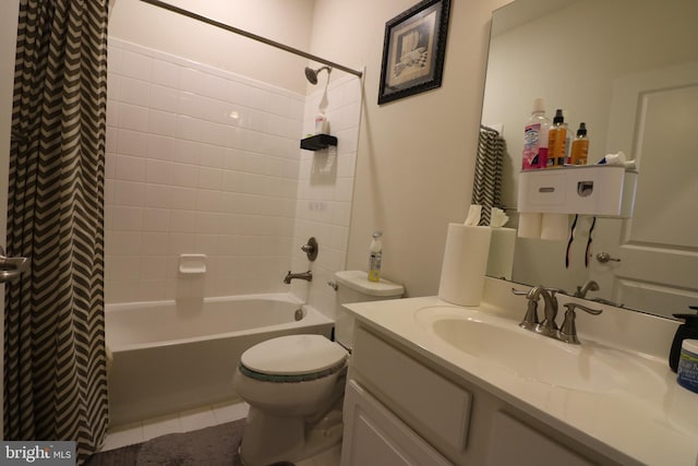 bathroom with vanity, tile patterned floors, toilet, and shower / bath combo