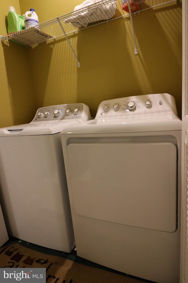 laundry area featuring laundry area and washing machine and dryer