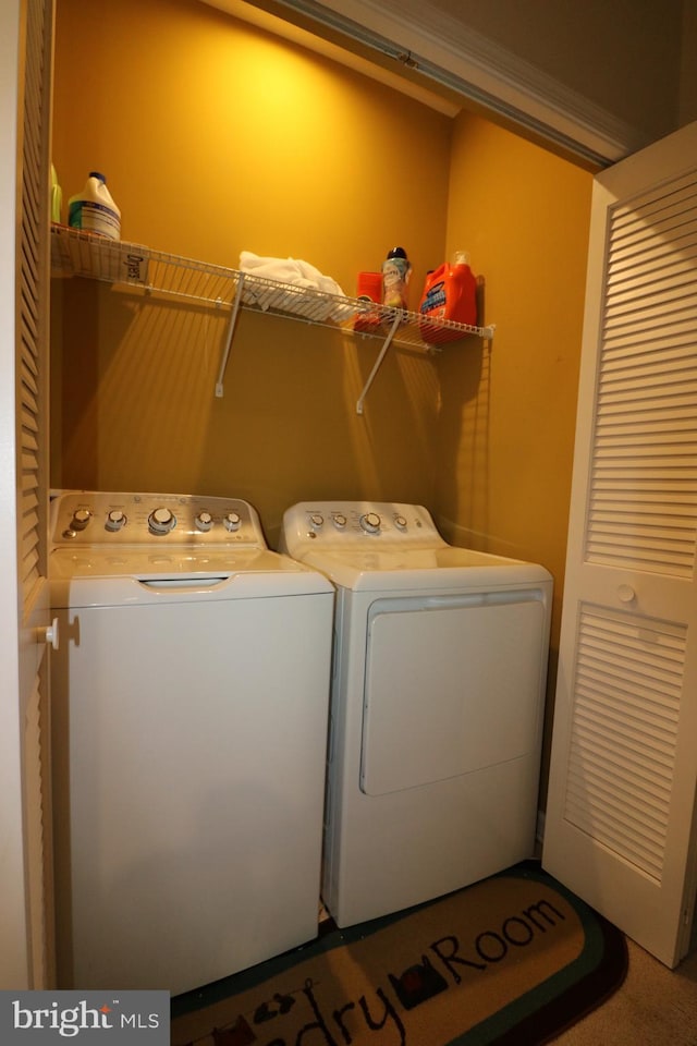 laundry area with laundry area and separate washer and dryer