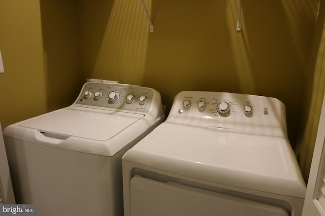 washroom with laundry area and separate washer and dryer