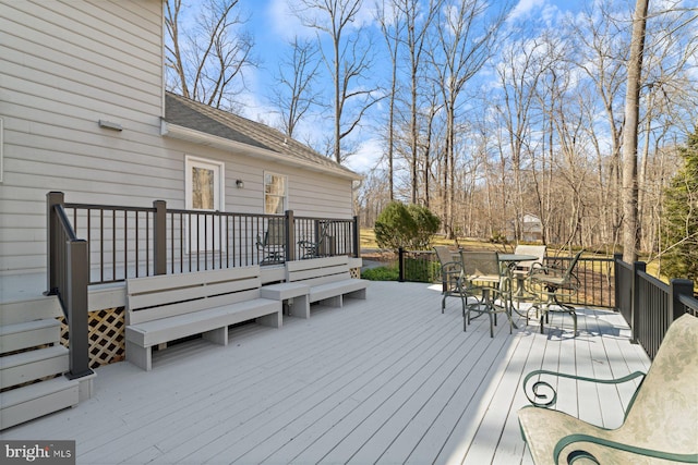 wooden deck with outdoor dining space