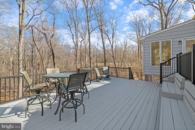 wooden deck with outdoor dining space