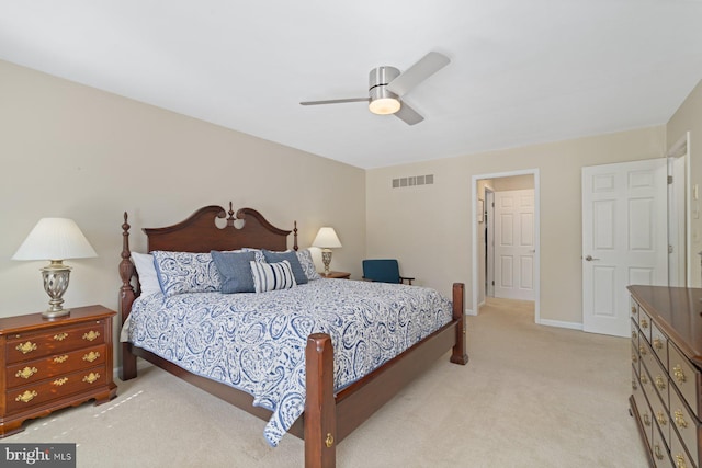 bedroom with visible vents, light carpet, baseboards, and a ceiling fan