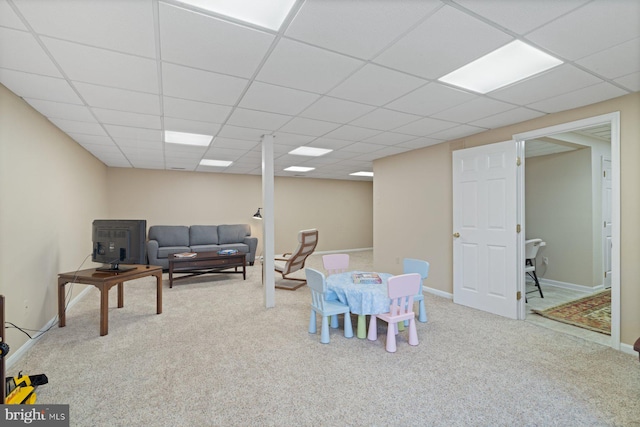 game room featuring a drop ceiling, baseboards, and carpet flooring