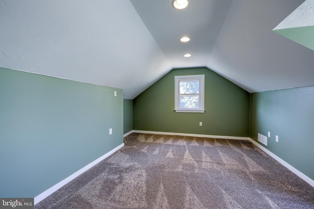 bonus room with baseboards, visible vents, recessed lighting, vaulted ceiling, and carpet flooring