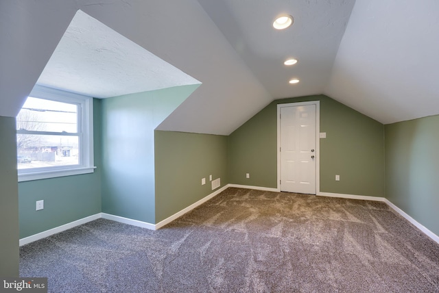 bonus room with recessed lighting, carpet, lofted ceiling, and baseboards