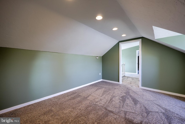 bonus room with recessed lighting, baseboards, carpet floors, and lofted ceiling