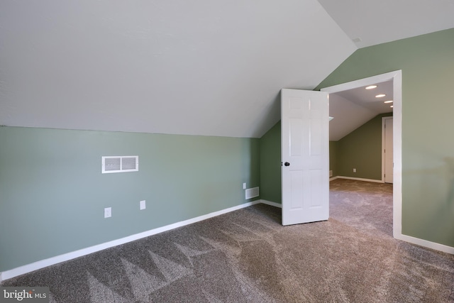 bonus room with carpet, vaulted ceiling, baseboards, and visible vents