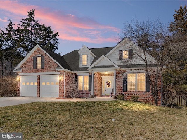 view of front of home with fence, driveway, a front lawn, a garage, and brick siding