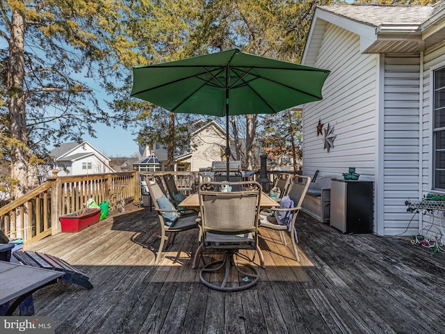 wooden deck with outdoor dining area