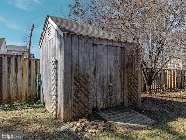 view of shed featuring a fenced backyard