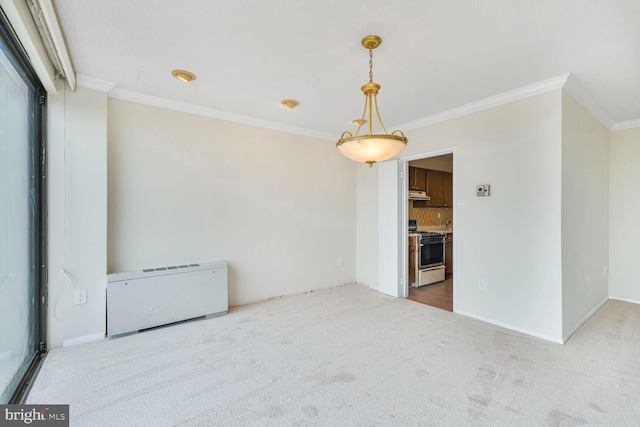 unfurnished room featuring carpet floors, baseboards, and ornamental molding