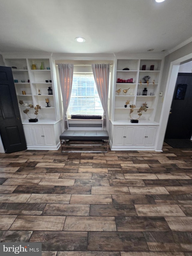 interior space with ornamental molding and recessed lighting