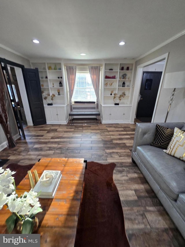 living room featuring ornamental molding, recessed lighting, built in features, and wood finished floors