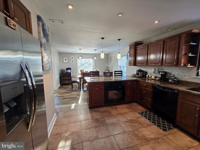 kitchen featuring a peninsula, open shelves, hanging light fixtures, black appliances, and tasteful backsplash