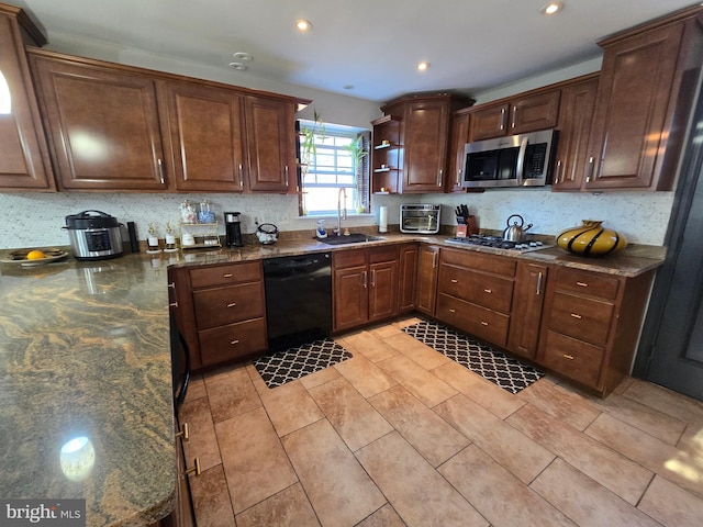 kitchen featuring a toaster, decorative backsplash, appliances with stainless steel finishes, open shelves, and a sink