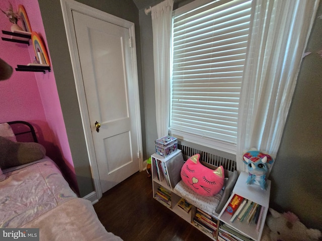 bedroom with wood finished floors