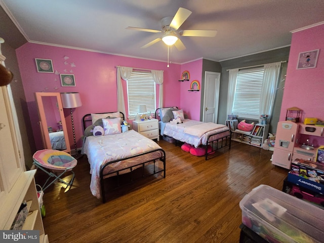 bedroom featuring ceiling fan, ornamental molding, and wood finished floors