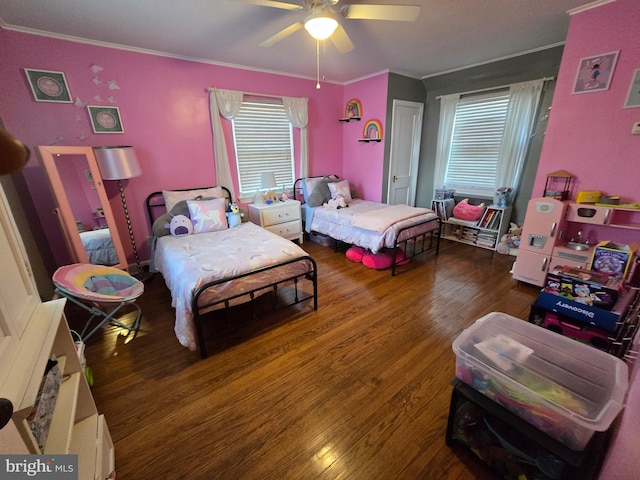 bedroom with ornamental molding, wood finished floors, and a ceiling fan