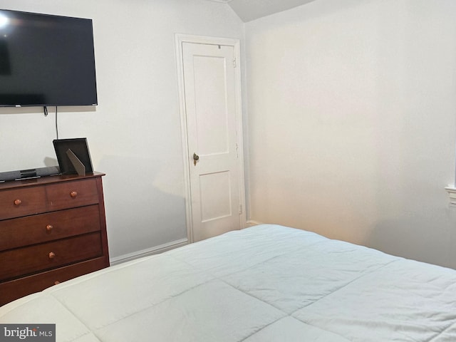 bedroom featuring vaulted ceiling