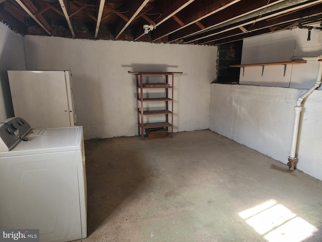 unfinished below grade area with washer / clothes dryer