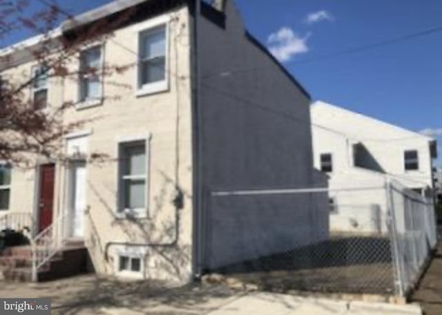 view of property exterior with fence