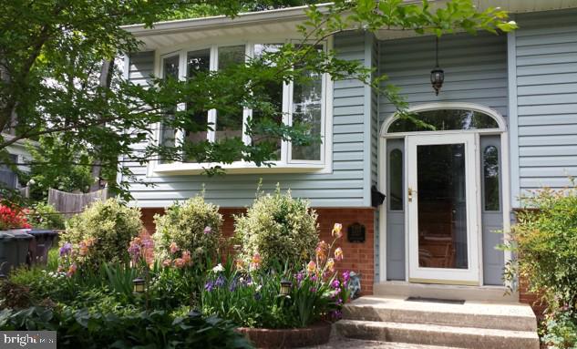 doorway to property with brick siding