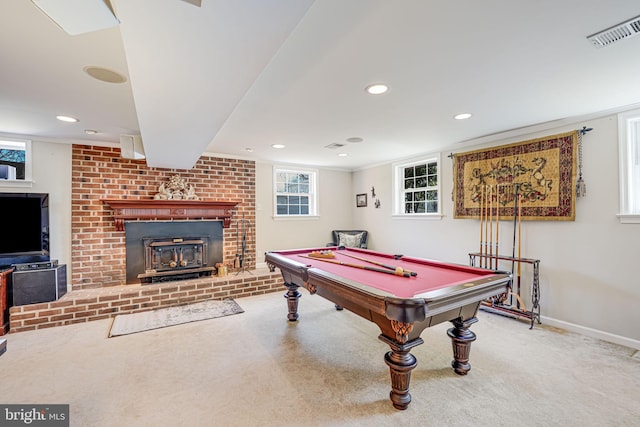 playroom featuring visible vents, carpet floors, plenty of natural light, and a brick fireplace