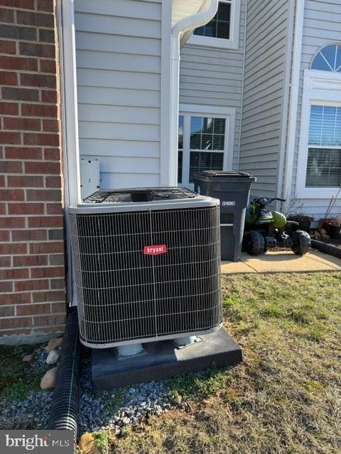 details with brick siding and central AC unit