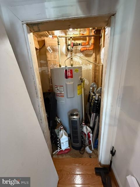 utility room featuring electric water heater