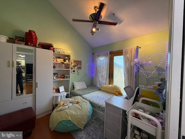 bedroom featuring vaulted ceiling and a ceiling fan