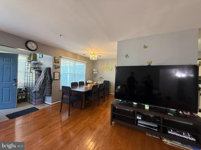 interior space with baseboards and wood finished floors