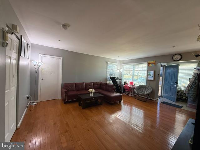 living area with hardwood / wood-style floors