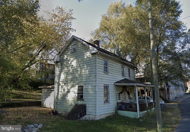 view of side of property with a chimney