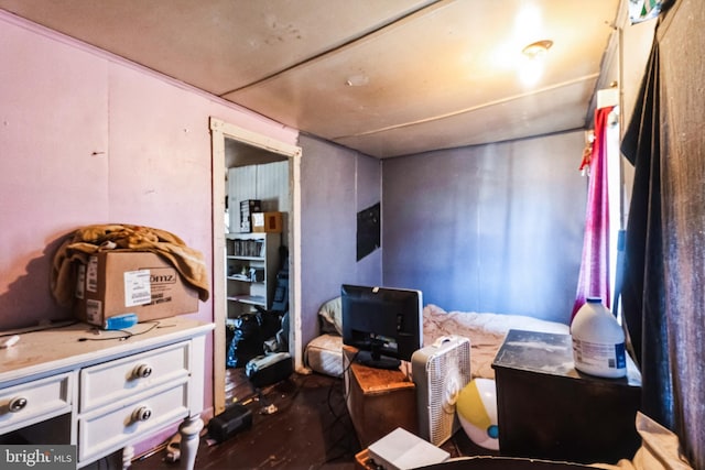 bedroom with dark wood-type flooring