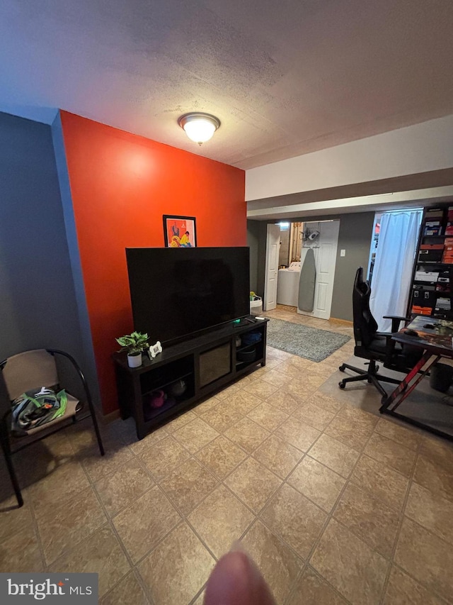 living room featuring a textured ceiling