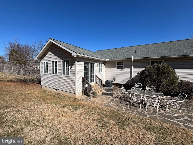 rear view of house with entry steps, a patio, central AC, a shingled roof, and crawl space