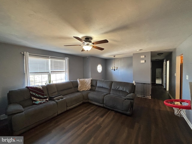 living area with dark wood-style floors and a ceiling fan