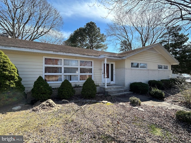 single story home with brick siding