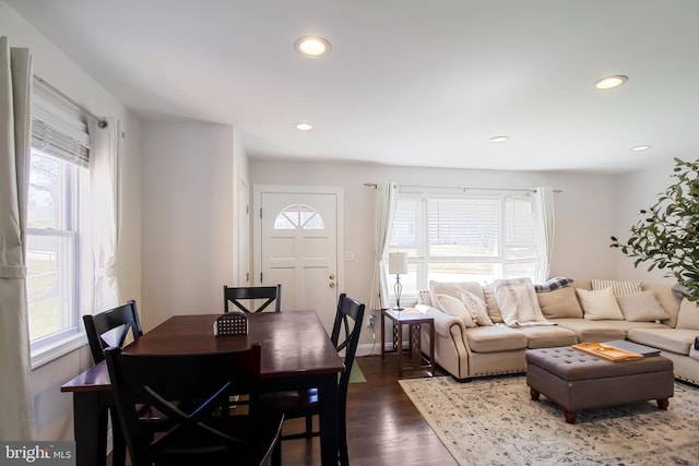 dining room with recessed lighting, baseboards, and wood finished floors