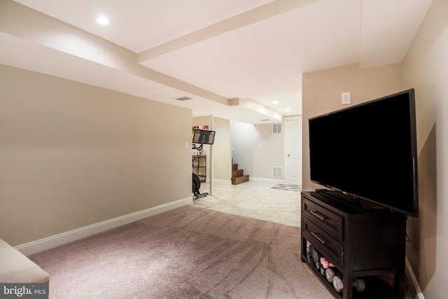 interior space featuring visible vents, stairway, light colored carpet, and baseboards